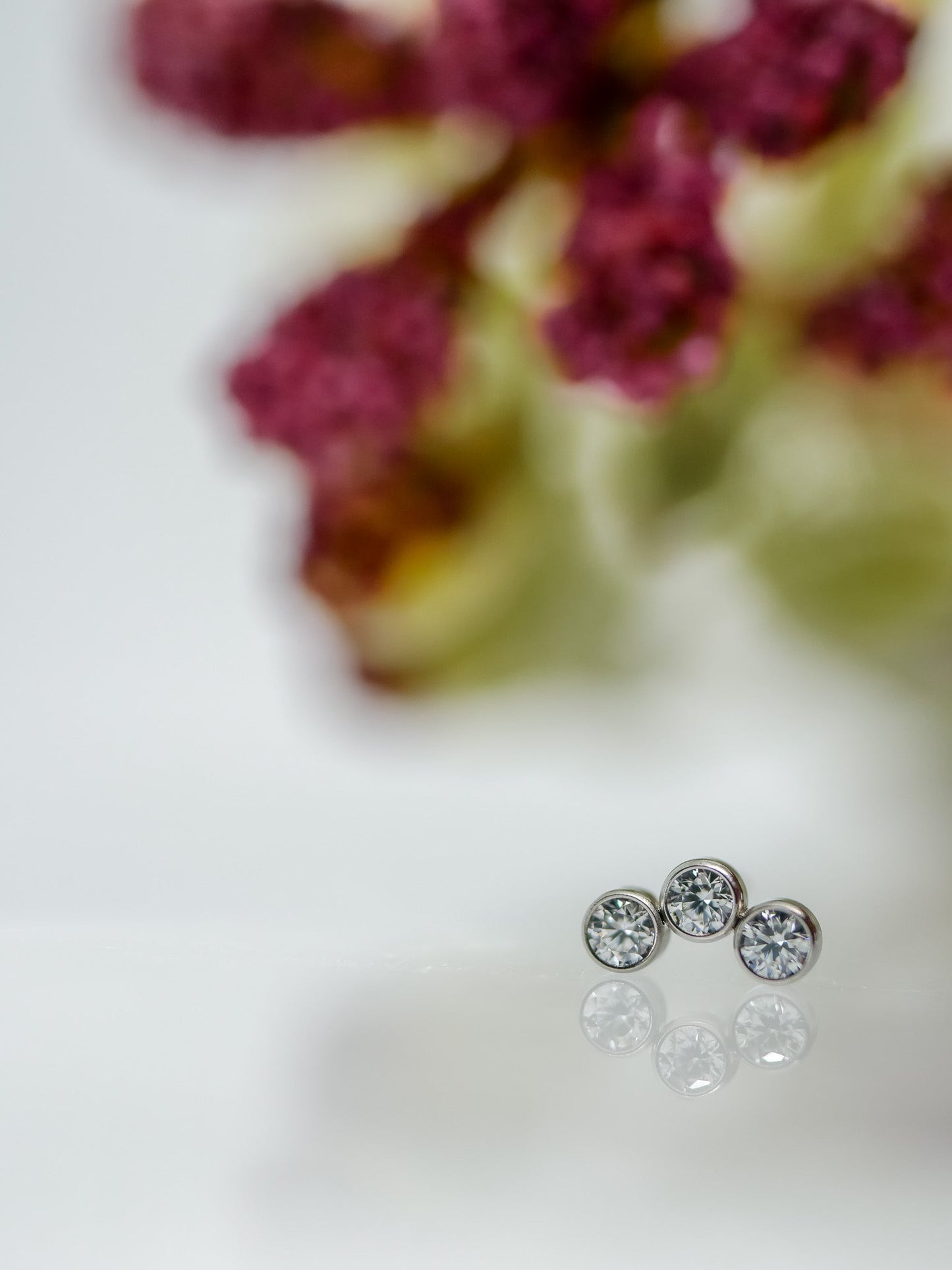 3 1.5mm clear bezel gems in a curved cluster body jewelry