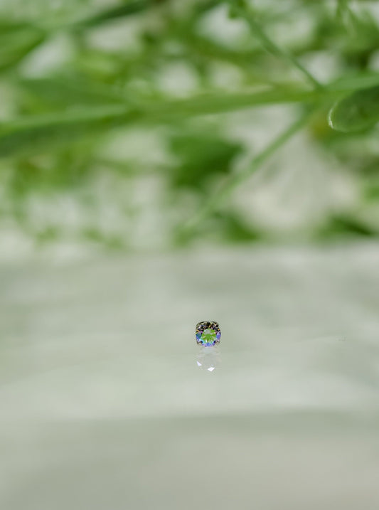 Small Rainbow coloured stone with purples, pinks, green and blue